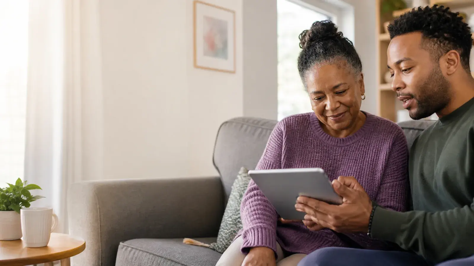 Family members reviewing information together on a tablet at home